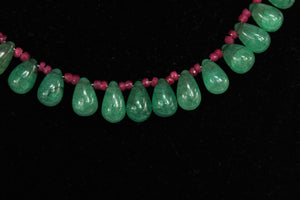 Precious ruby and emerald drops stone necklace with traditional Indian thread